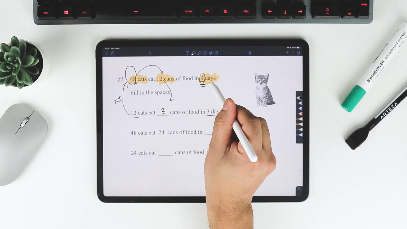 Person solving maths problem on tablet