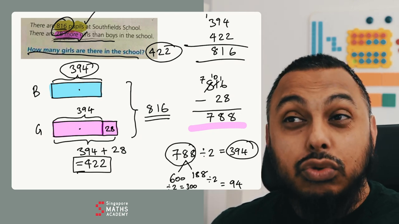 Teacher explains maths problem to students.